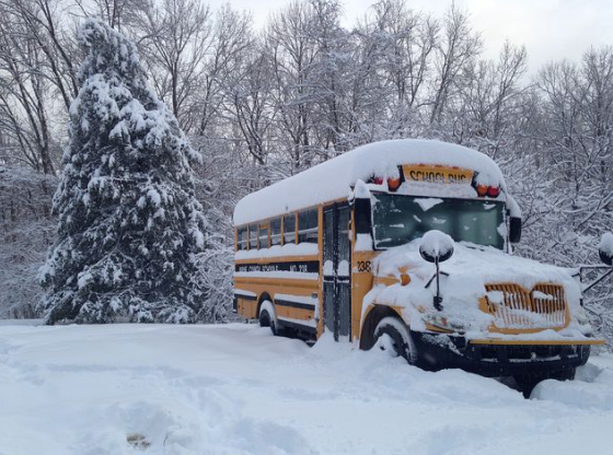 A school bus parked in the snow